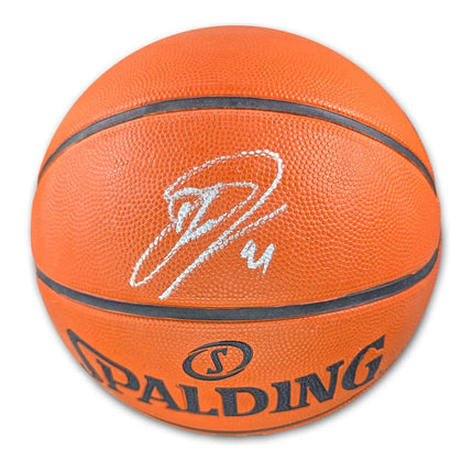 Dirk Nowitzki autographed Spalding NBA basketball, featuring his white signature across the textured orange game ball surface.