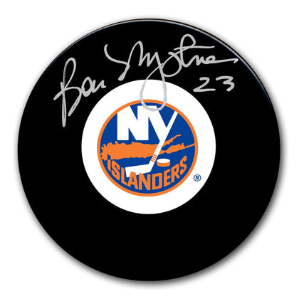 Bob Nystrom autographed New York Islanders hockey puck, featuring the teams logo and a clear silver signature above the emblem.