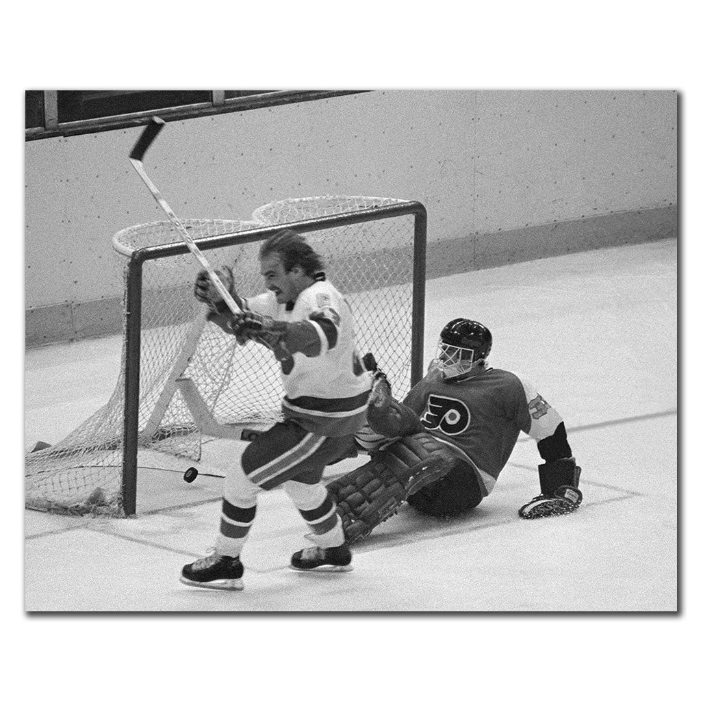 Black-and-white photo of Bob Nystrom celebrating near the Philadelphia Flyers net