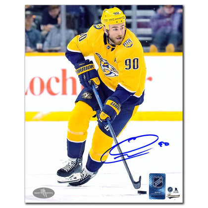 Ryan OReilly #90 in yellow—Nashville Predators signed 8x10 photo, blue autograph visible directly on the glossy paper.