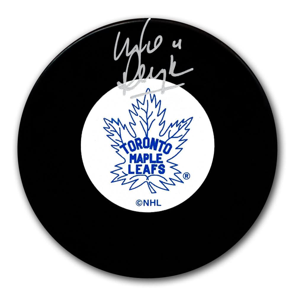 Toronto Maple Leafs hockey puck autographed by Mike Pelyk in silver ink, presented as collectible sports memorabilia.