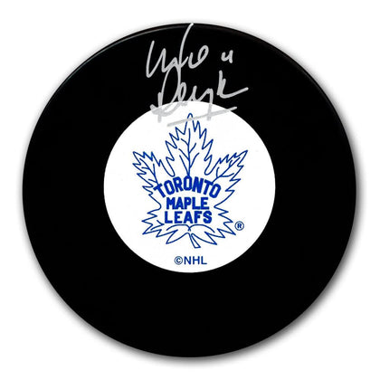 Toronto Maple Leafs hockey puck autographed by Mike Pelyk in silver ink, presented as collectible sports memorabilia.