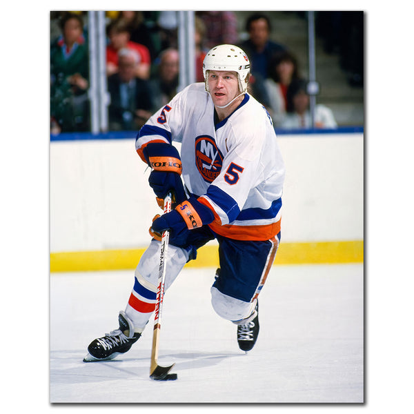 Denis Potvin New York Islanders 8x10 hockey photo in a white uniform skating with his stick on the ice for autograph pre-order