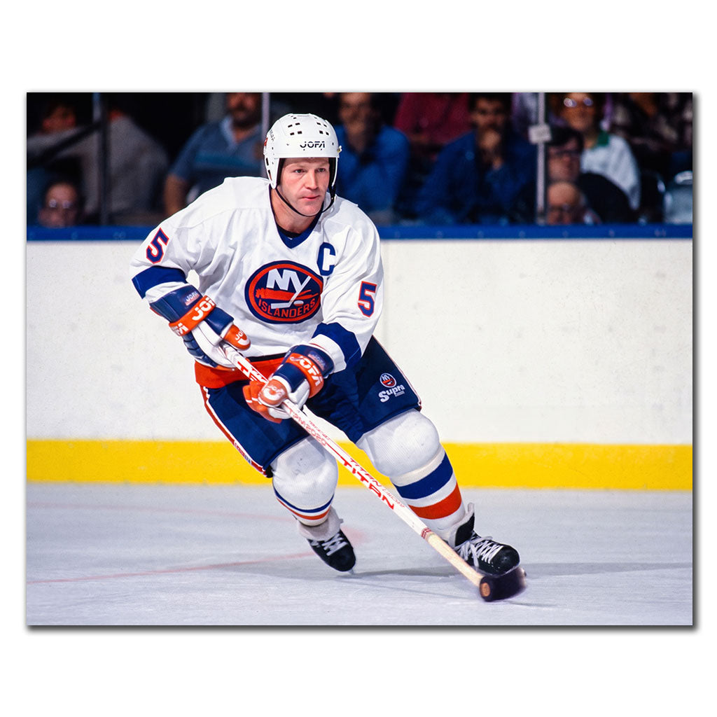 Denis Potvin New York Islanders 8x10 hockey photo in a white captain uniform skating during an NHL game for autograph pre-order