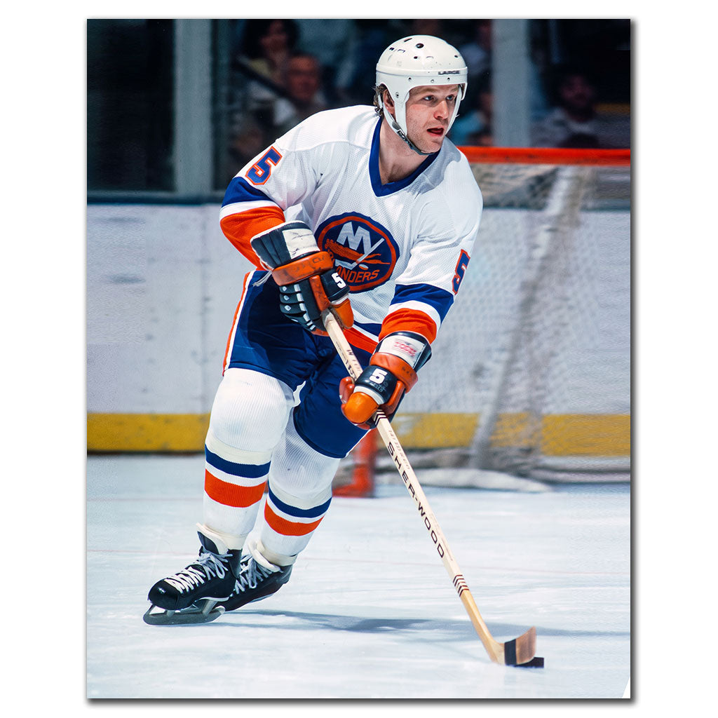 Denis Potvin New York Islanders 8x10 hockey photo in a white uniform skating with the puck during an NHL game for autograph pre-order