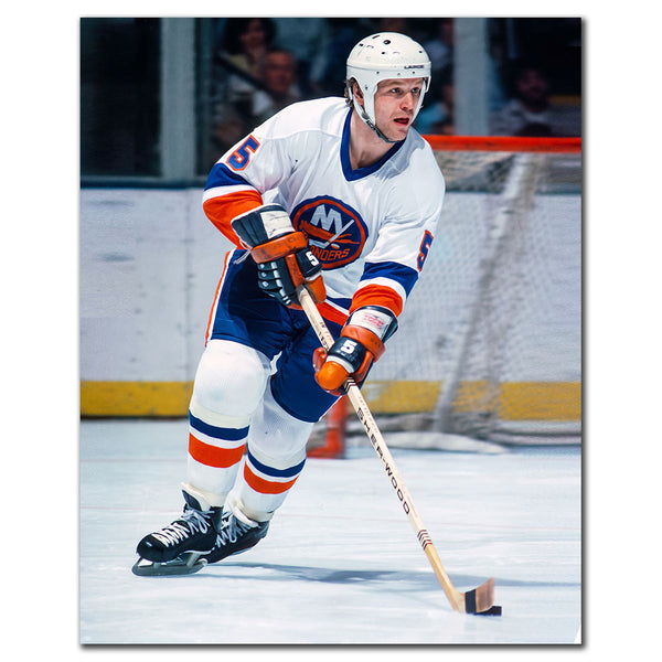 Denis Potvin New York Islanders 8x10 hockey photo in a white uniform skating with the puck during an NHL game for autograph pre-order