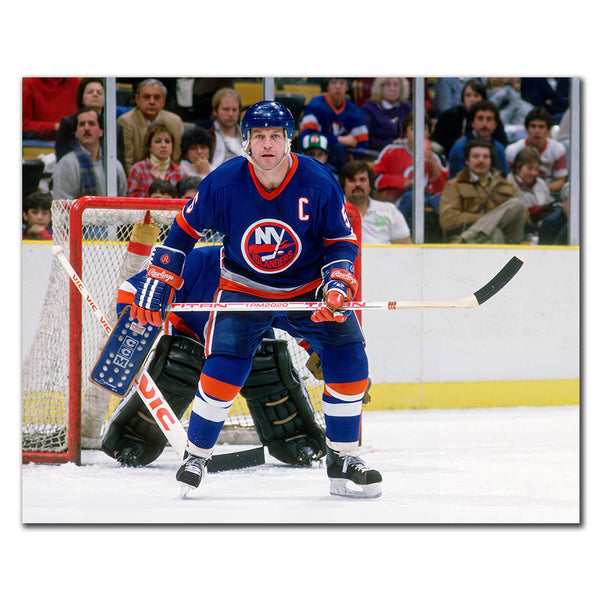 Denis Potvin New York Islanders 16x20 hockey photo in a blue captain uniform positioned in front of the net for autograph pre-order