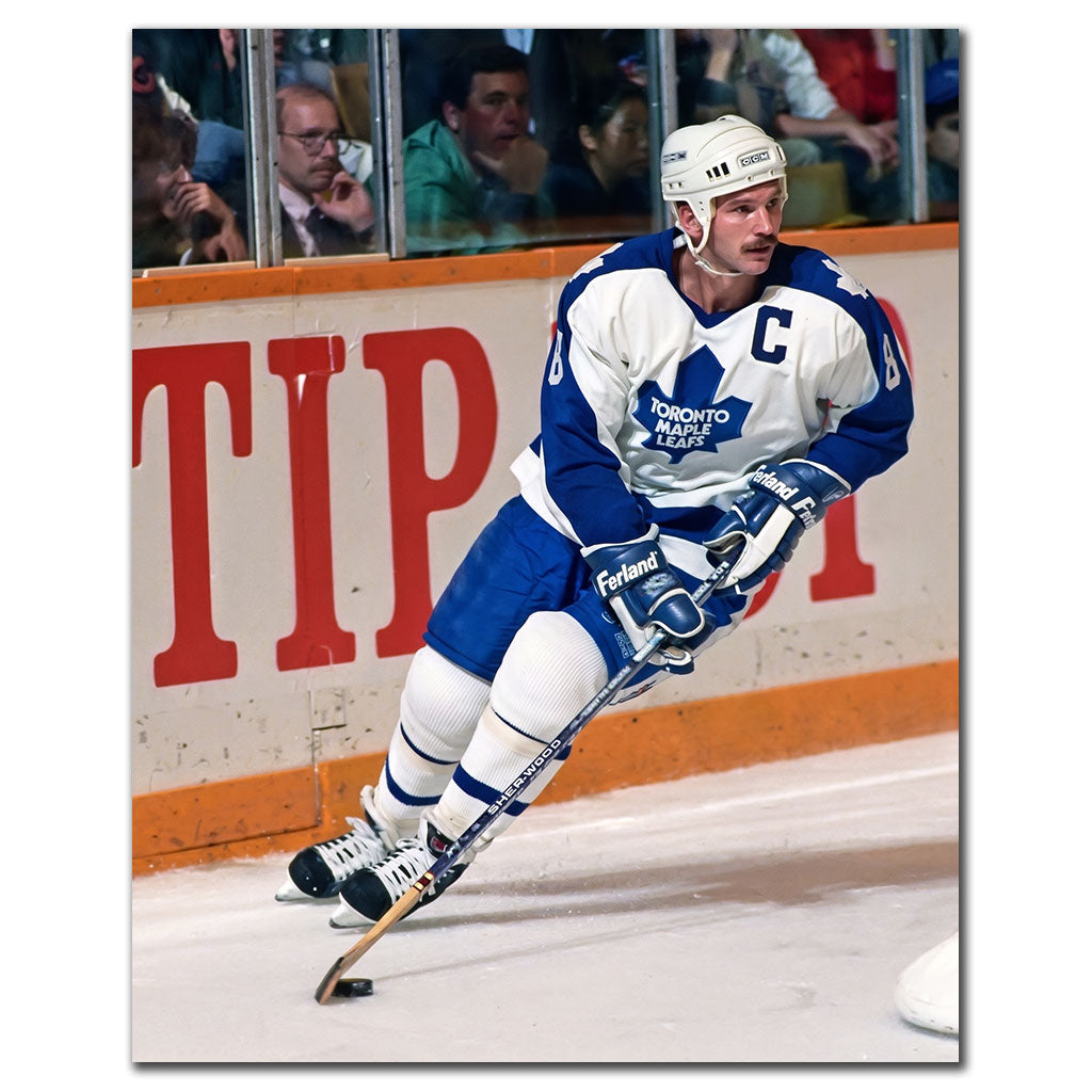 Rob Ramage skating in a white Toronto Maple Leafs uniform