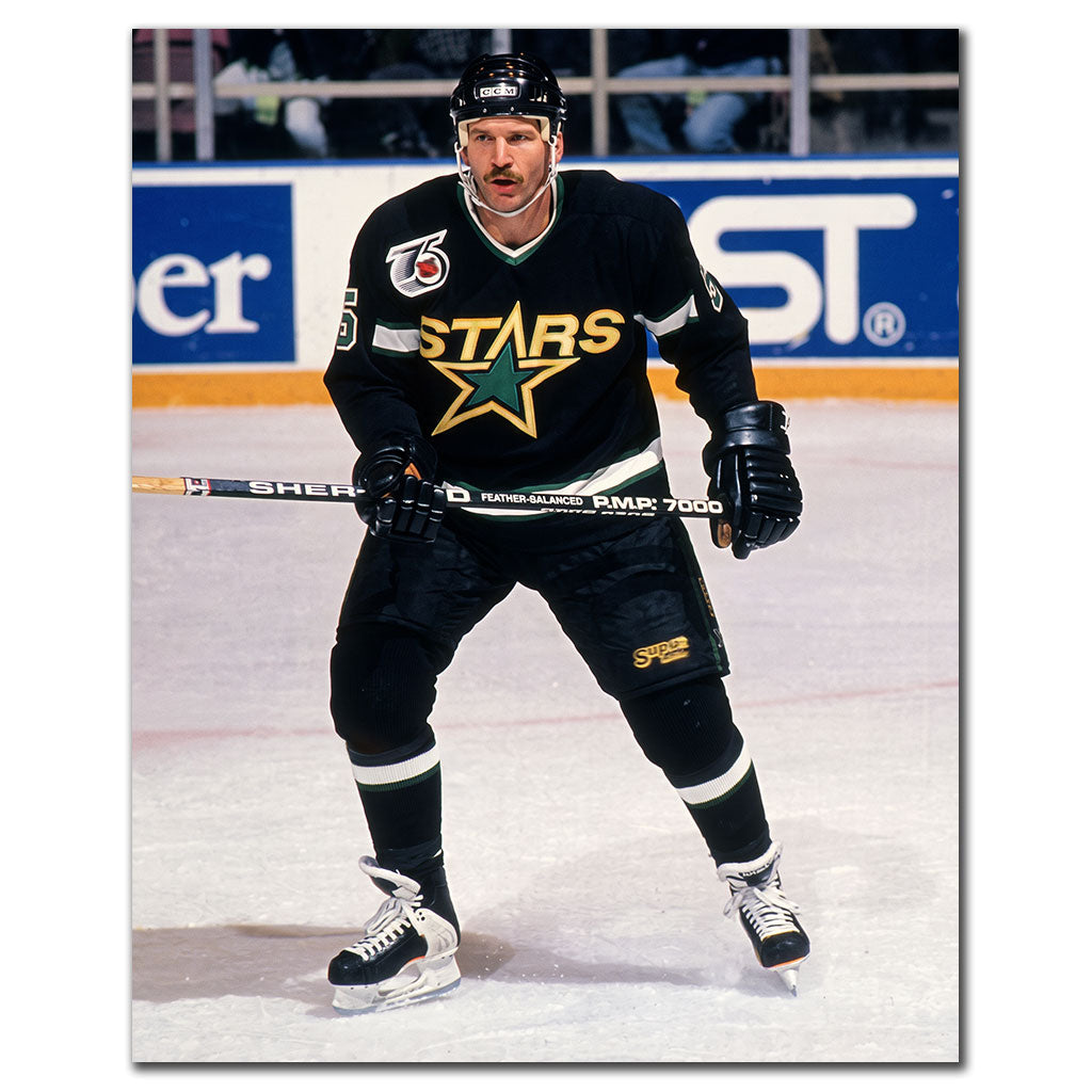 Rob Ramage on the ice in a black Minnesota North Stars uniform