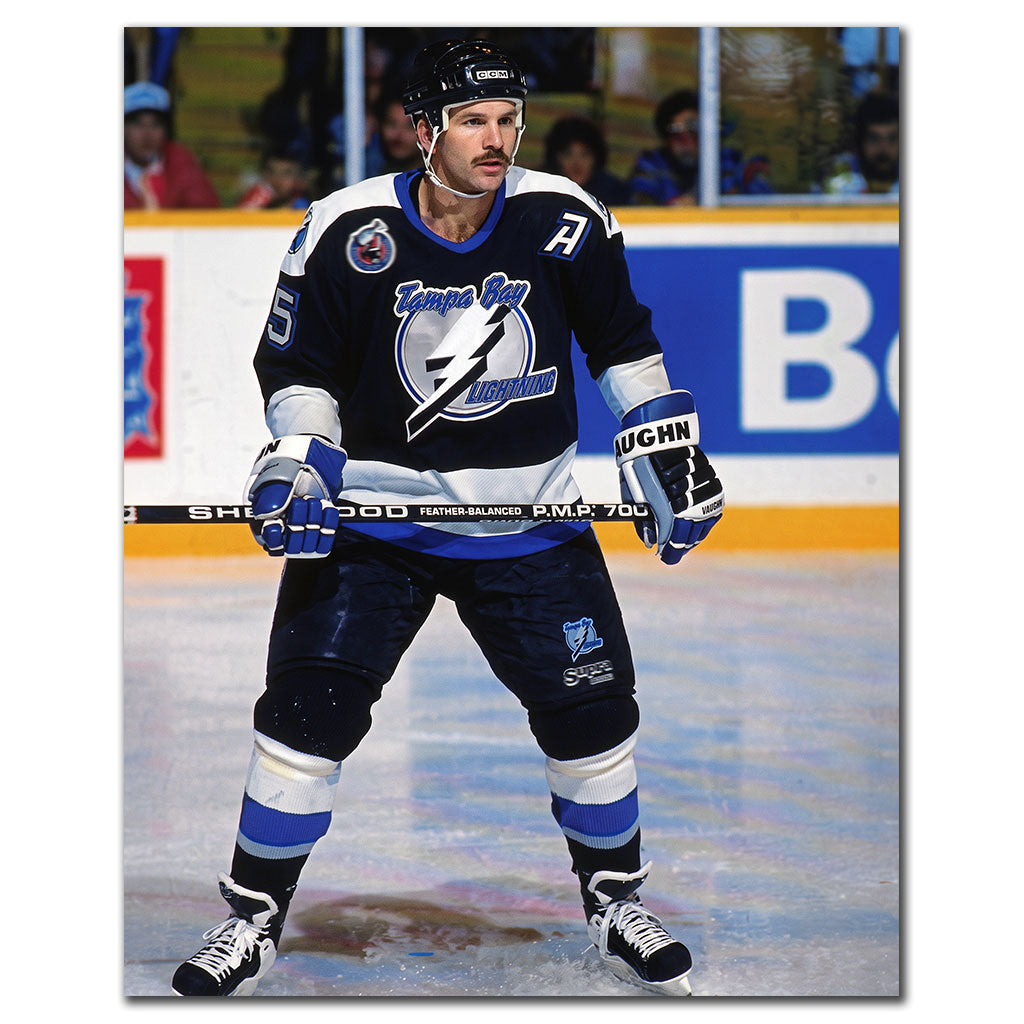 Rob Ramage on the ice in a black Tampa Bay Lightning uniform