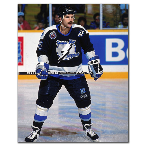 Rob Ramage on the ice in a black Tampa Bay Lightning uniform