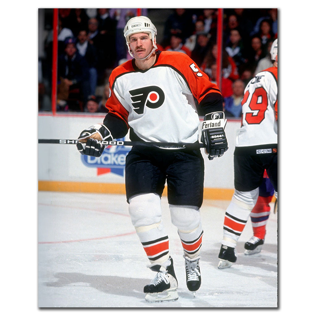 Rob Ramage on the ice in a white Philadelphia Flyers uniform