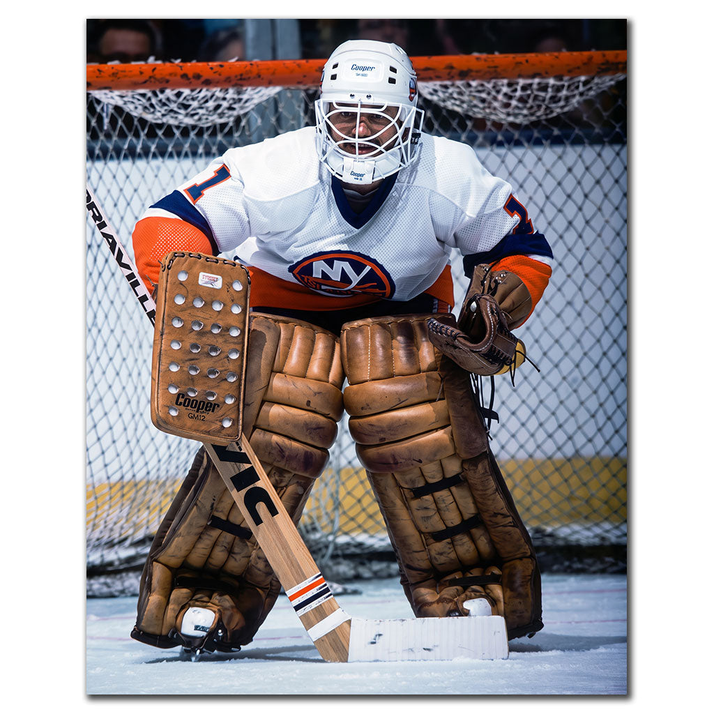 Chico Resch New York Islanders 8x10 hockey photo wearing a white goalie helmet and white uniform while crouched in front of the net for autograph pre-order
