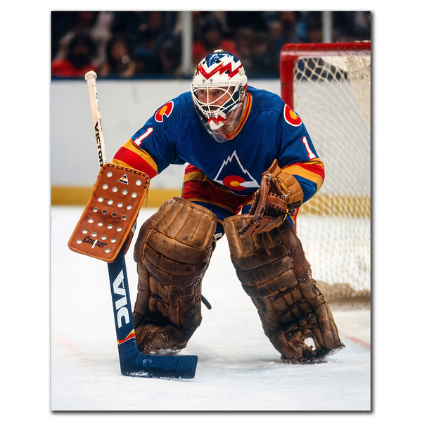 Chico Resch Colorado Rockies 8x10 hockey photo wearing a blue jersey and a white, blue and red goalie mask while crouched in front of the net for autograph pre-order