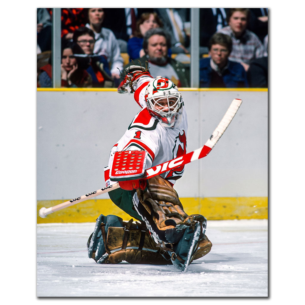 Chico Resch New Jersey Devils 8x10 hockey photo wearing a white jersey and matching goalie mask while making a kneeling save with his catching glove raised for autograph pre-order