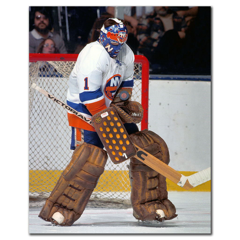 Chico Resch New York Islanders 16x20 hockey photo wearing a white jersey and blue, orange and white goalie mask while standing in front of the net with vintage brown goalie equipment for autograph pre-order