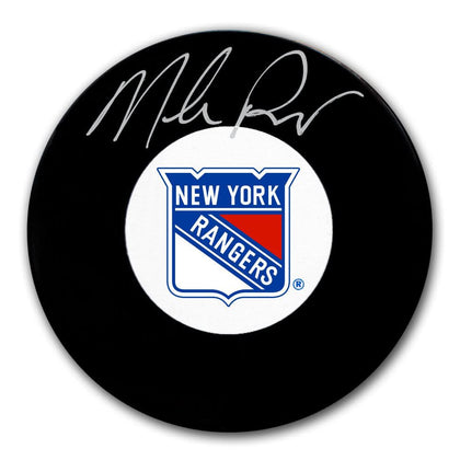 Mike Richter-signed New York Rangers hockey puck, autographed in silver ink, displayed with its Certificate of Authenticity.