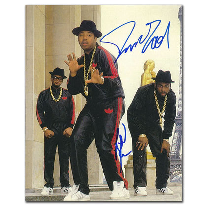 RUN-DMC Paris 8x10 photo, featuring three men in black, dual signed by Darryl McDaniels and Joseph Simmons, unframed.