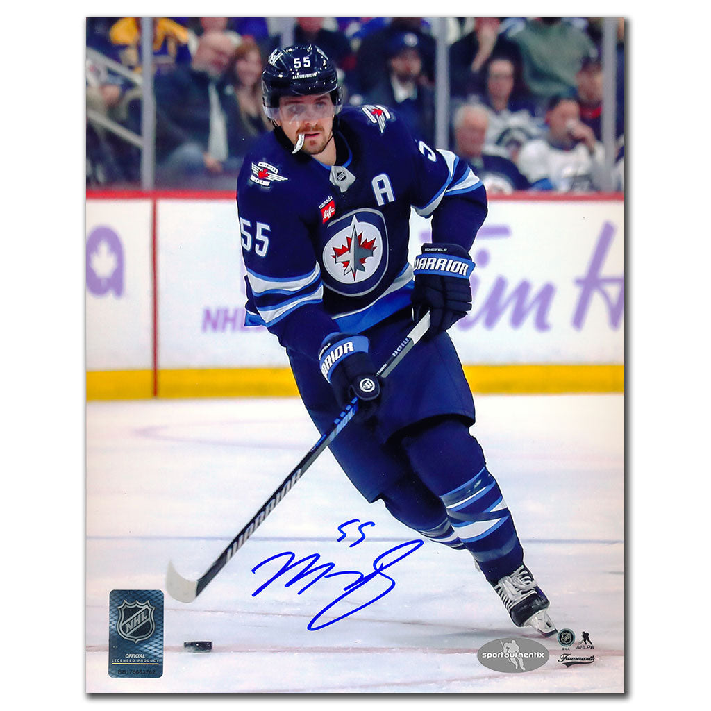 Mark Scheifele autographed Winnipeg Jets 8x10 photo in blue jersey skating with puck
