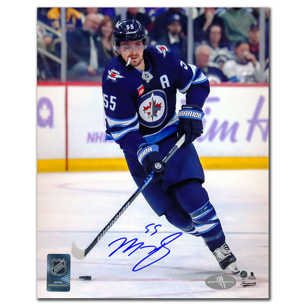 Mark Scheifele autographed Winnipeg Jets 8x10 photo in blue jersey skating with puck