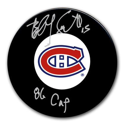 Bobby Smith autographed 1986 Montreal Canadiens Stanley Cup puck; a signed collectible hockey puck for memorabilia collections.