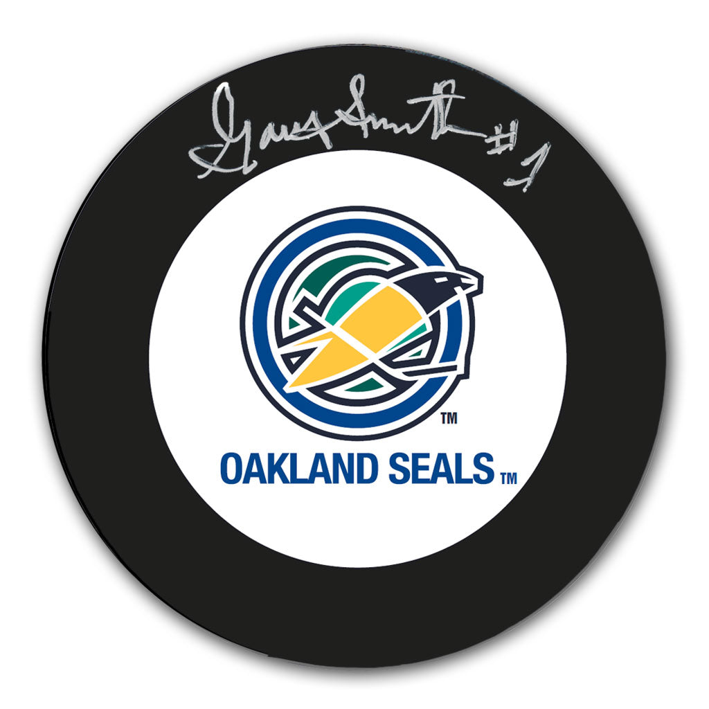Gary Smith autographed Oakland Seals hockey puck with vintage team logo and silver signature