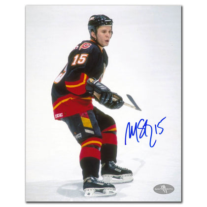 Martin St. Louis autographed Calgary Flames 8x10 rookie photo, hand-signed in black, presented as premium sports memorabilia.