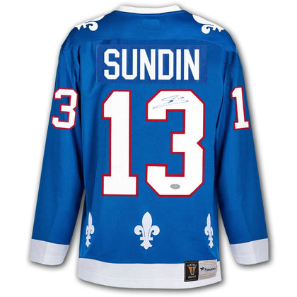 Mats Sundin autographed Quebec Nordiques vintage blue jersey featuring white fleur-de-lis accents and bold SUNDIN 13 on back.