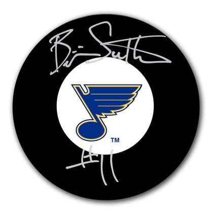 Brian Sutter autographed St. Louis Blues hockey puck with two silver signatures and team logo, collectible memorabilia.