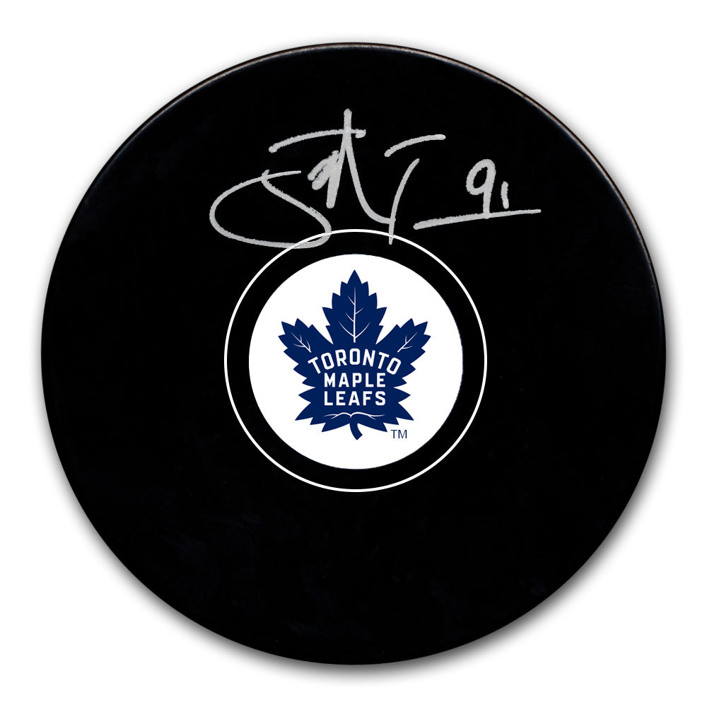 John Tavares autographed Toronto Maple Leafs hockey puck with silver signature