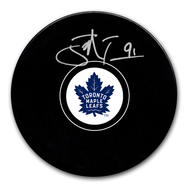 John Tavares autographed Toronto Maple Leafs hockey puck with silver signature