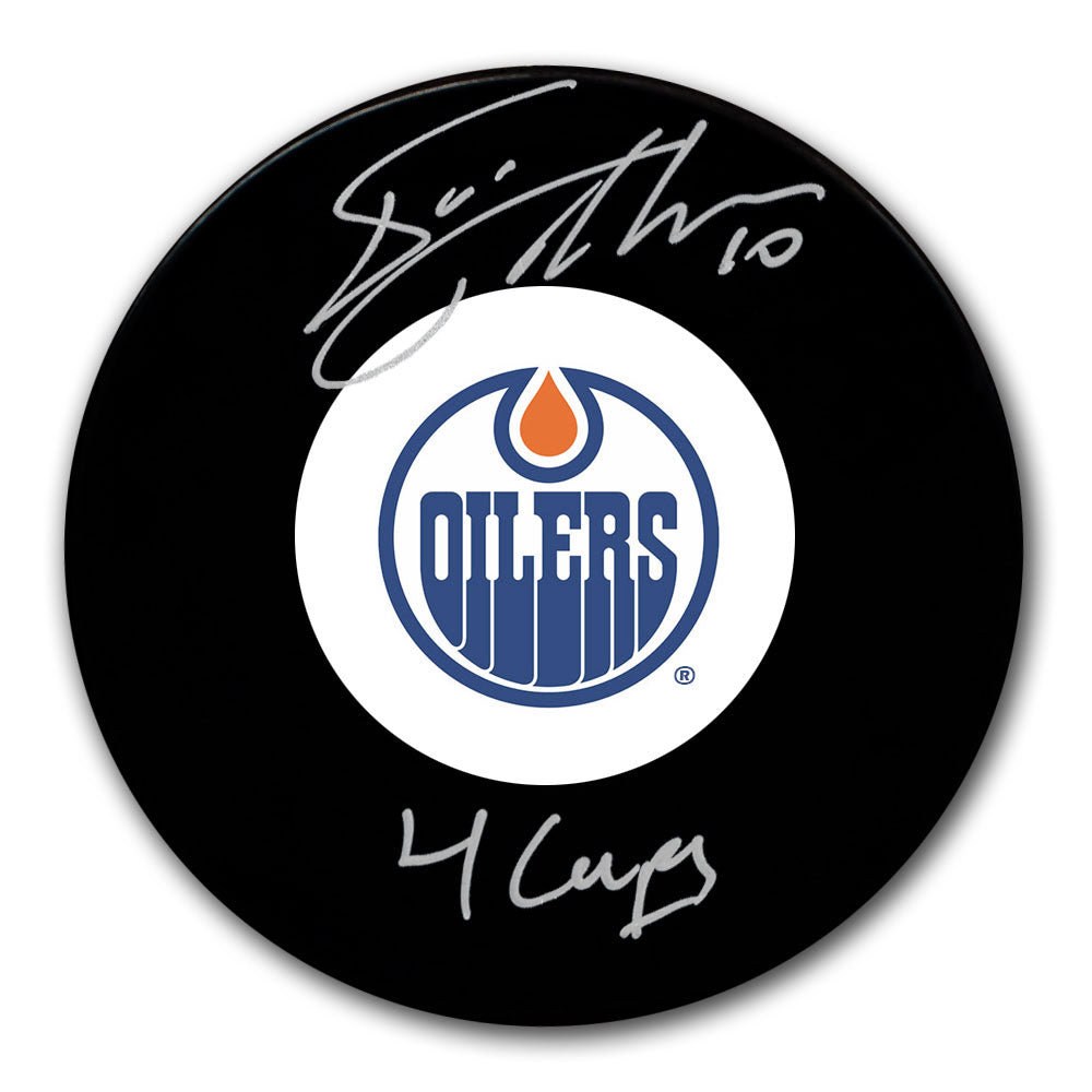 Esa Tikkanen autographed Edmonton Oilers hockey puck with 4 Cups inscription