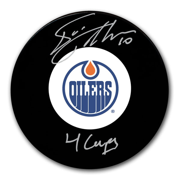 Esa Tikkanen autographed Edmonton Oilers hockey puck with 4 Cups inscription