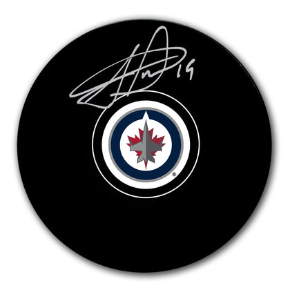 Jonathan Toews Winnipeg Jets signed hockey puck featuring his autograph—a standout collectible for devoted Winnipeg Jets fans.