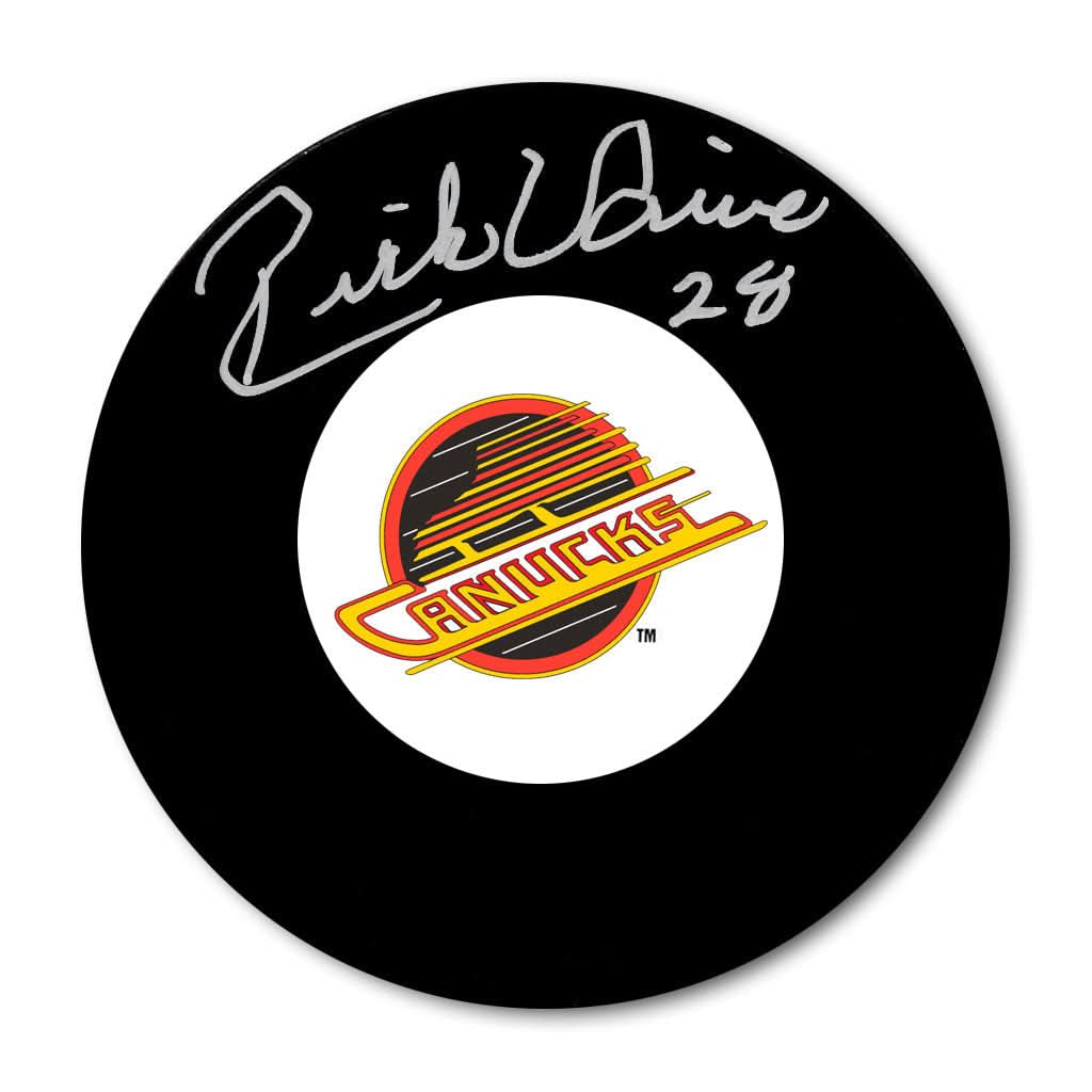 Rick Vaive Vancouver Canucks signed hockey puck featuring a clear silver autograph—premium collectible for NHL memorabilia fans.