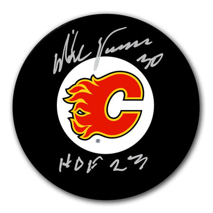 Mike Vernon Calgary Flames signed hockey puck featuring the team logo and HOF 23 inscription, commemorating his HOF induction.