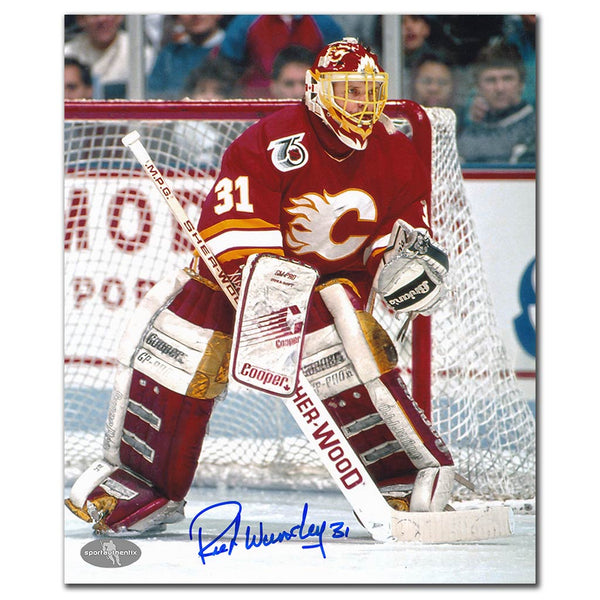 Rick Wamsley autographed Calgary Flames 8x10 photo guarding the crease in a red jersey