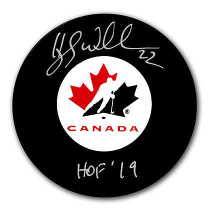 Hayley Wickenheiser Team Canada HOF signed black hockey puck—premium NHL memorabilia featuring her autograph on the surface.