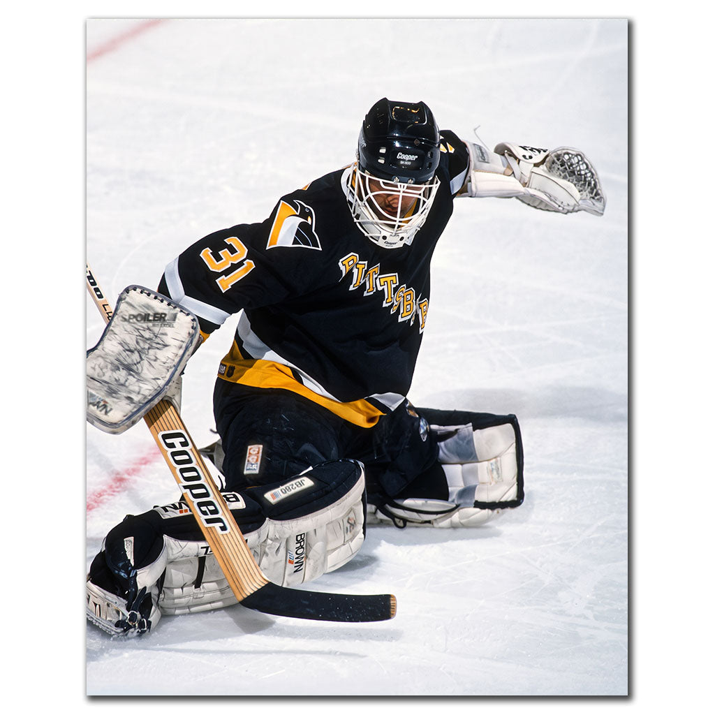 Ken Wregget making a save in a black Pittsburgh Penguins uniform