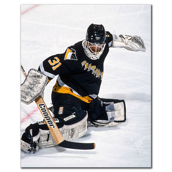 Ken Wregget making a save in a black Pittsburgh Penguins uniform