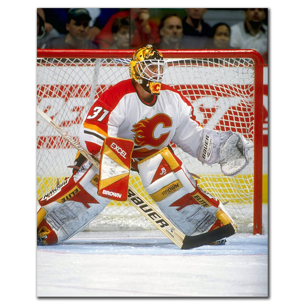 Ken Wregget tending goal in a red Calgary Flames uniform
