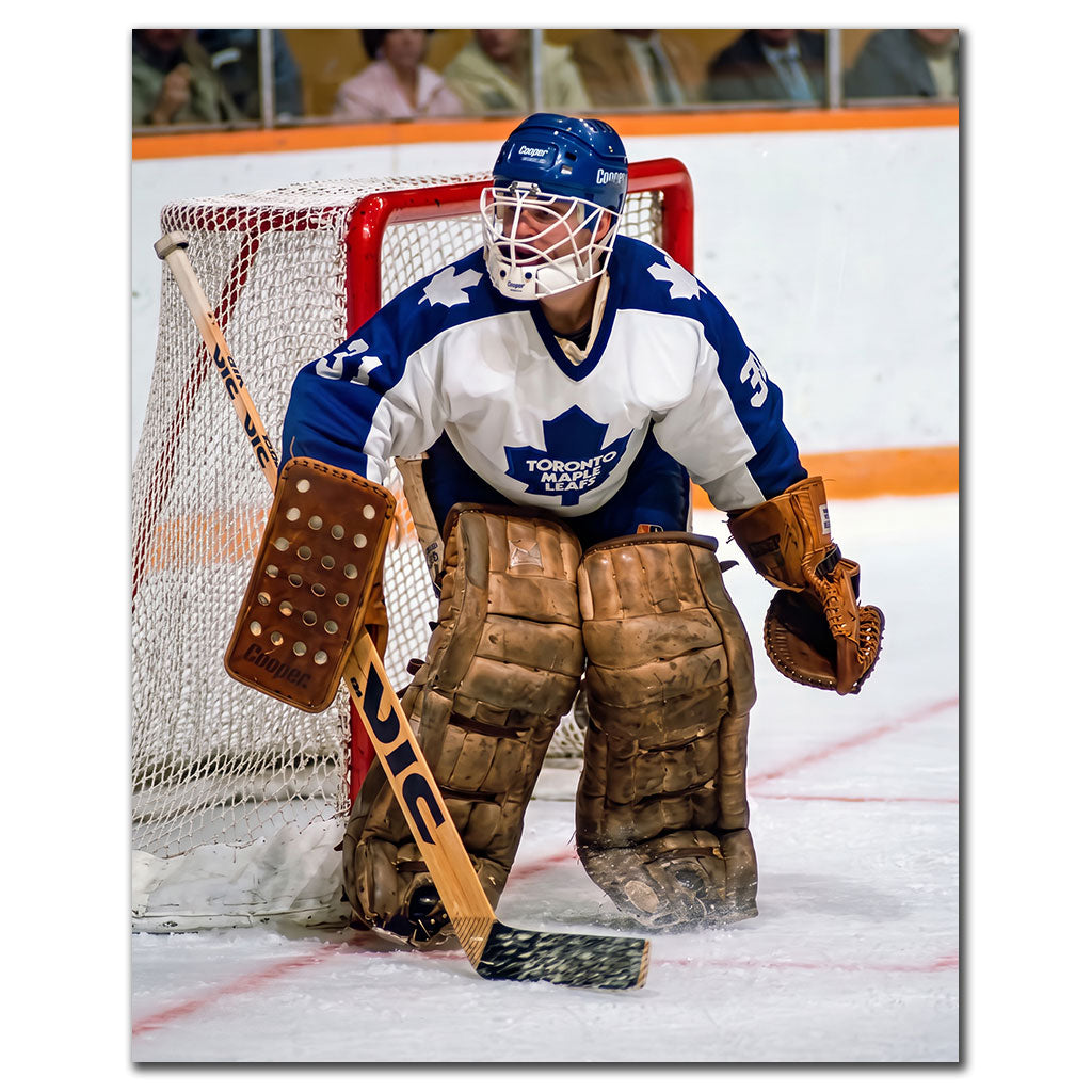 Ken Wregget positioned in front of the net in a white Toronto Maple Leafs uniform