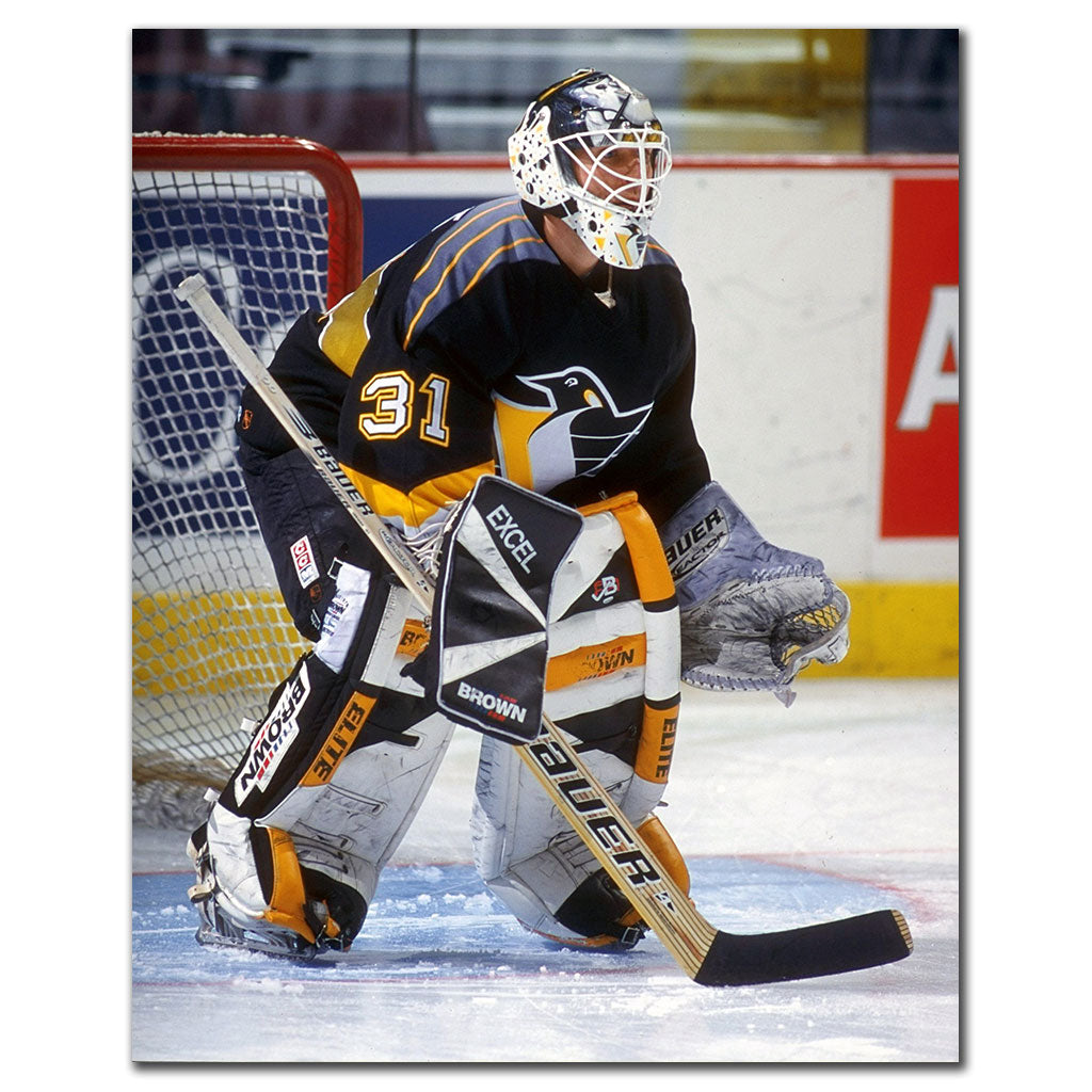 Ken Wregget tending goal in a black Pittsburgh Penguins uniform