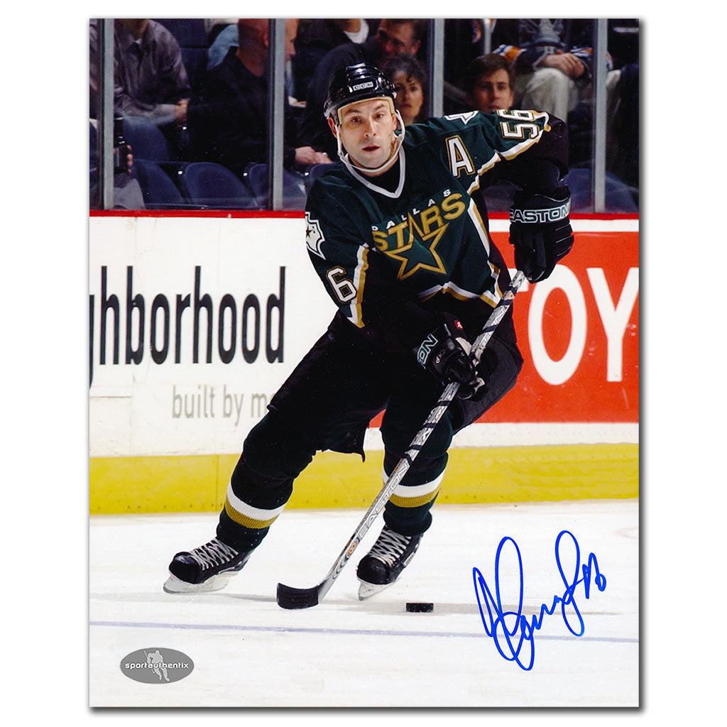Sergei Zubov autographed Dallas Stars 8x10 photo skating in black jersey with puck