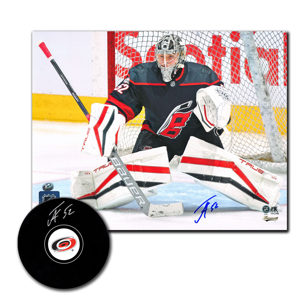 Pyotr Kochetkov autographed Carolina Hurricanes hockey puck and 8x10 photo combo